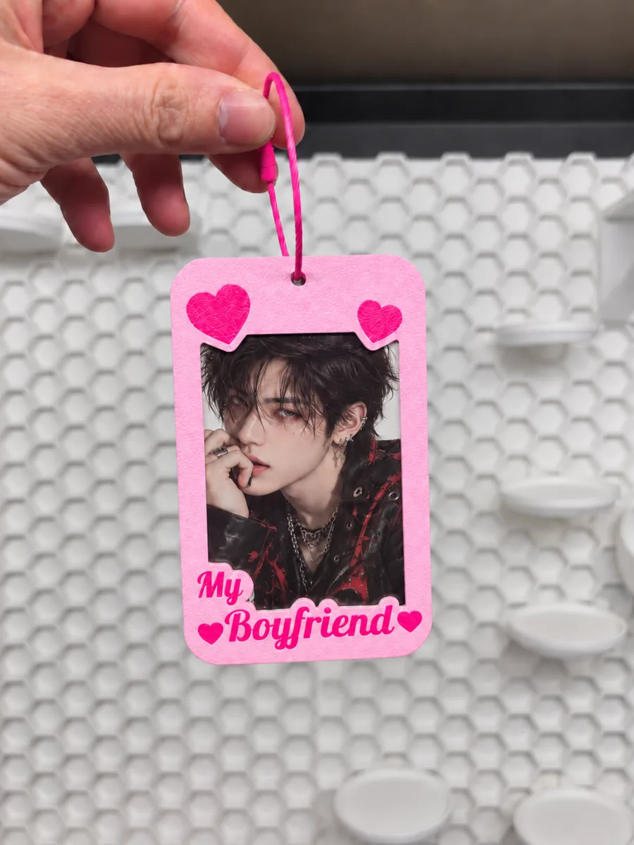 A printed photocard holder with a card inside
